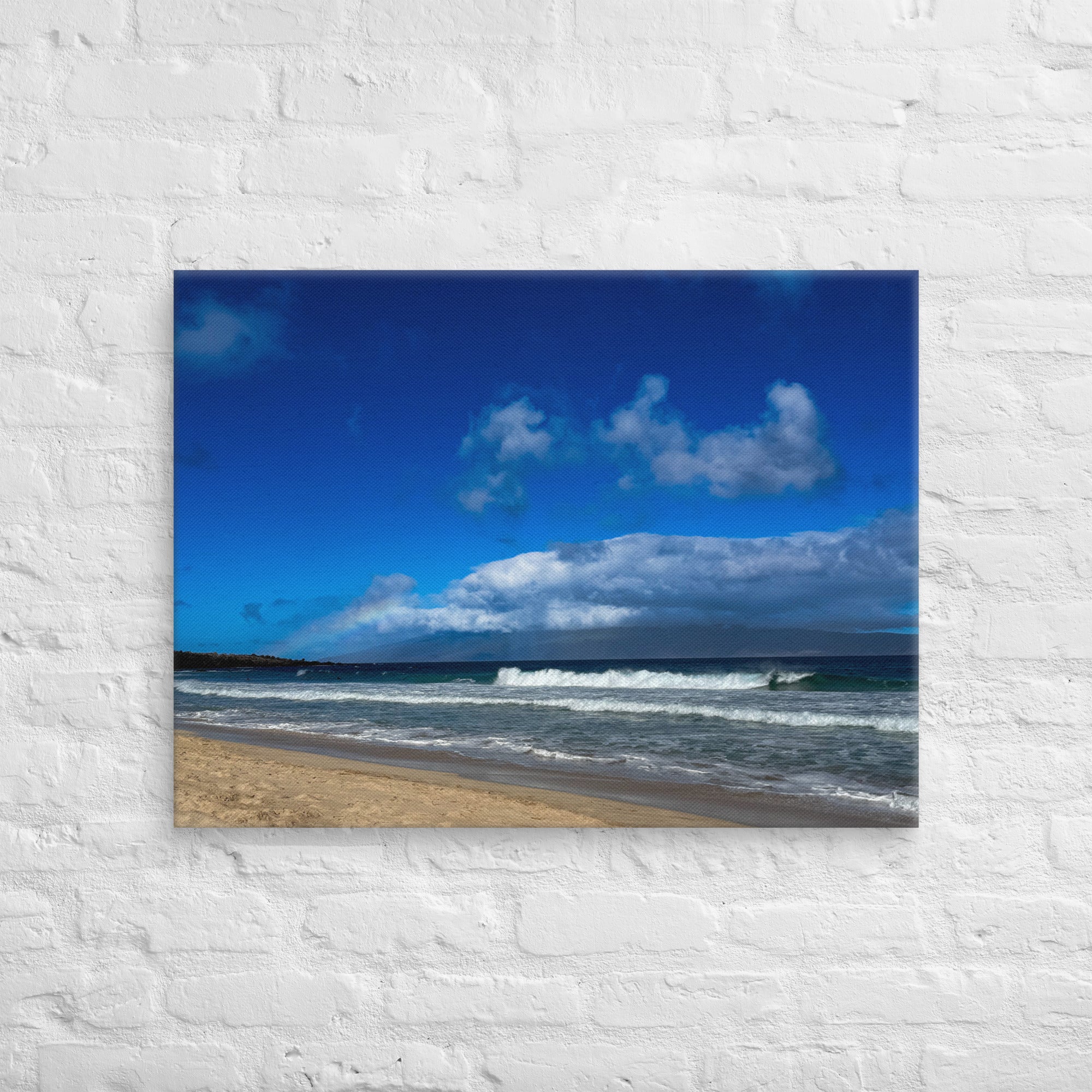 Oneloa Beach canvas print — soft rainbow over Lana'i with waves rolling onto Kapalua sand, Hawaii coastal wall art